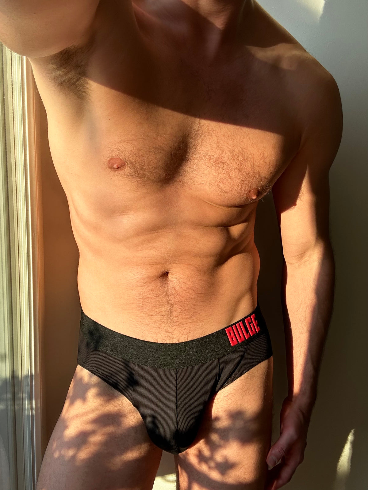 CLASSIC BRIEFS BULGE · BLACK · RED LOGO